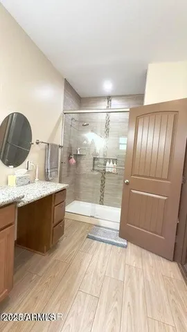 a bathroom with a sink and mirror