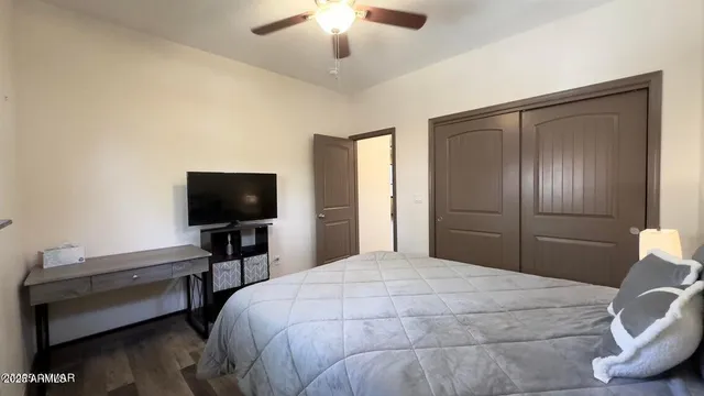 a bedroom with a bed and a chandelier