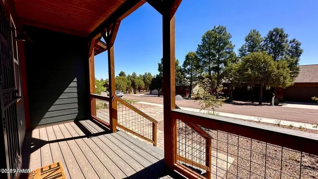 a view of balcony with wooden floor and city view