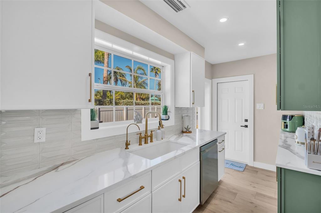 16613 Gulf Boulevard North Redington Beach, FL 33708 - Photo 11 of 51 a kitchen with a sink and a window
