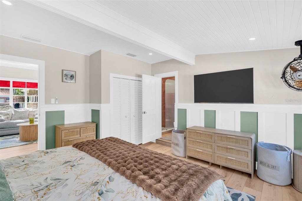 16613 Gulf Boulevard North Redington Beach, FL 33708 - Photo 19 of 51 a bedroom with a bed and a flat screen tv