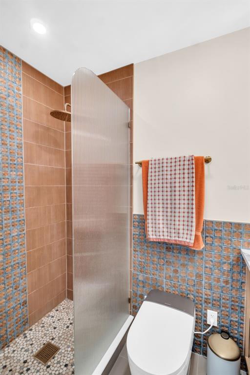 16613 Gulf Boulevard North Redington Beach, FL 33708 - Photo 21 of 51 a bathroom with a toilet and a shower