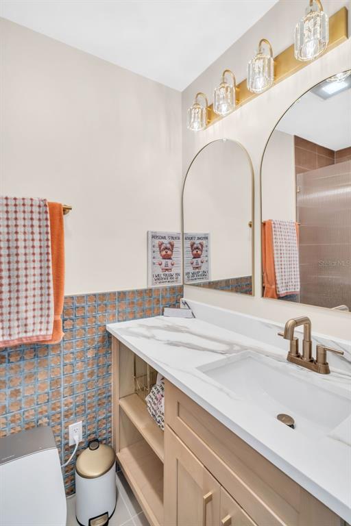 16613 Gulf Boulevard North Redington Beach, FL 33708 - Photo 22 of 51 a bathroom with a sink and a mirror