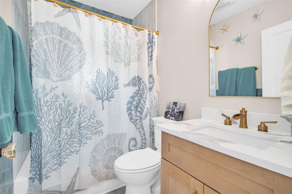 16613 Gulf Boulevard North Redington Beach, FL 33708 - Photo 24 of 51 a bathroom with a sink toilet and shower