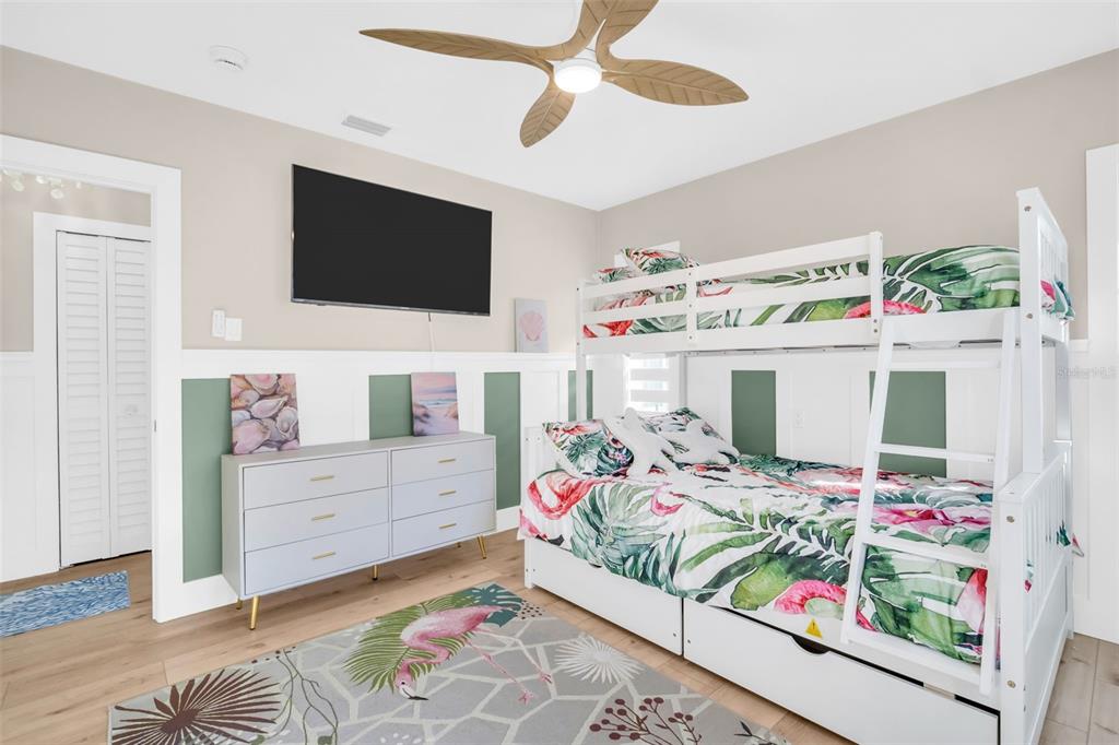 16613 Gulf Boulevard North Redington Beach, FL 33708 - Photo 27 of 51 a bedroom with a bed and flat screen tv