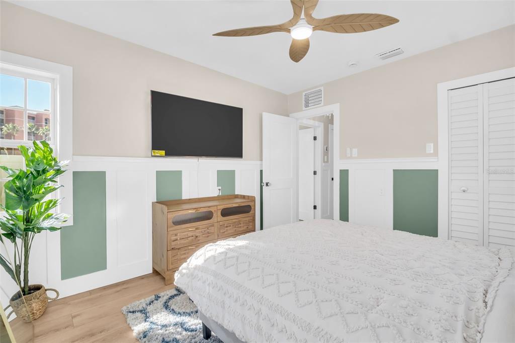 16613 Gulf Boulevard North Redington Beach, FL 33708 - Photo 29 of 51 a bedroom with a bed and a flat screen tv