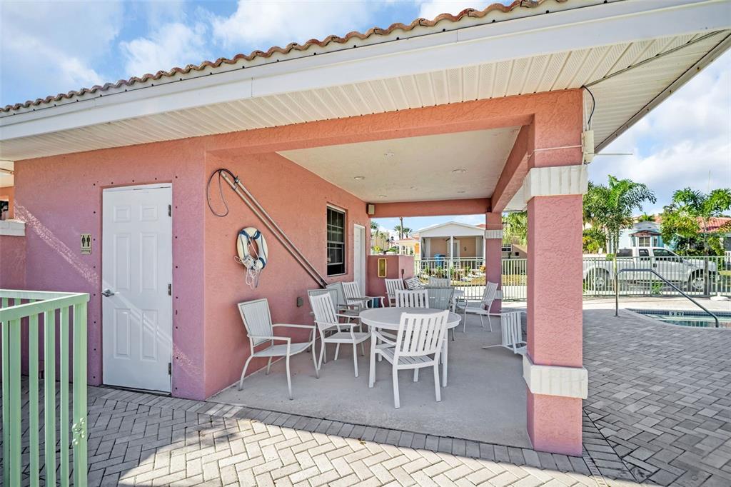 16613 Gulf Boulevard North Redington Beach, FL 33708 - Photo 39 of 51 a dining room with furniture and wooden floor