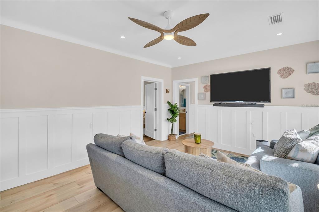 16613 Gulf Boulevard North Redington Beach, FL 33708 - Photo 5 of 51 a living room with furniture and a flat screen tv
