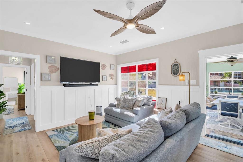 16613 Gulf Boulevard North Redington Beach, FL 33708 - Photo 6 of 51 a living room with furniture and a flat screen tv