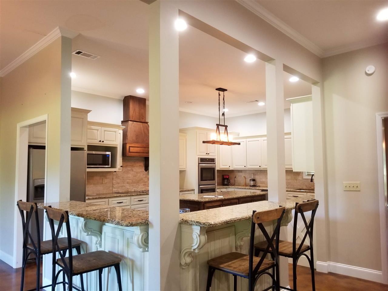 2 Cr 518b Road Rienzi, MS 38865 - Photo 24 of 24 a kitchen with a table chairs refrigerator and microwave