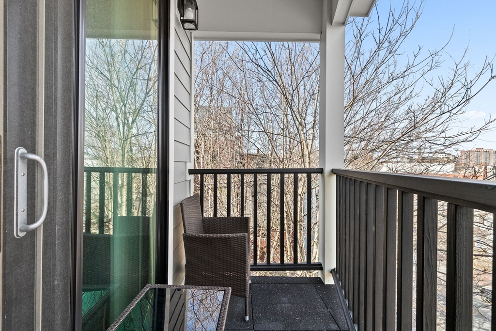17 Centre Street, Unit 2 Boston, MA 02119 - Photo 17 of 34 a view of a balcony with wooden floor and outdoor space