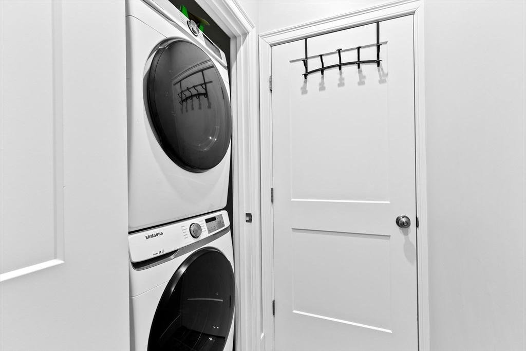 17 Centre Street, Unit 2 Boston, MA 02119 - Photo 30 of 34 a view of a hallway with washer and dryer