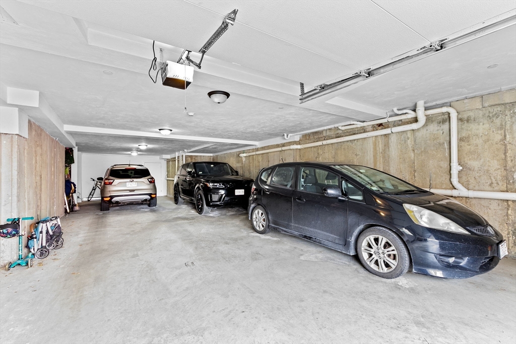 17 Centre Street, Unit 2 Boston, MA 02119 - Photo 32 of 34 a car parked in a garage