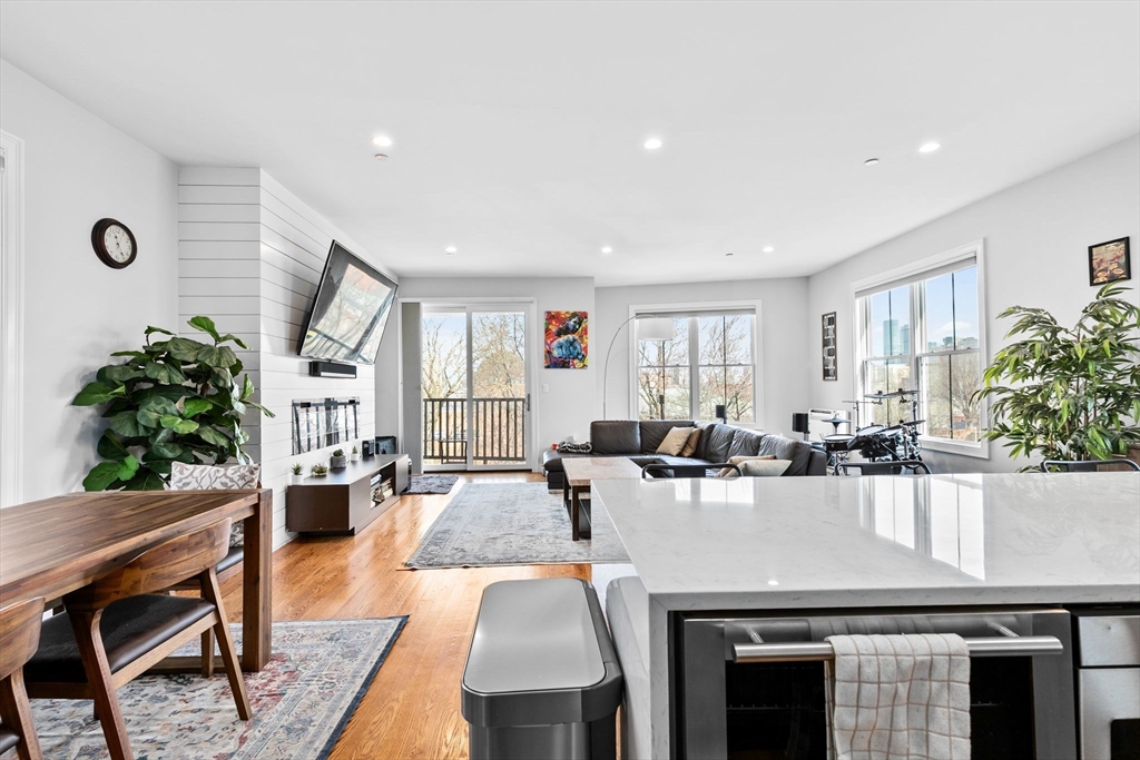 17 Centre Street, Unit 2 Boston, MA 02119 - Photo 7 of 34 a view of a dining room with furniture and wooden floor