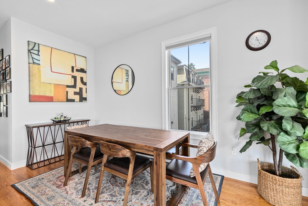 17 Centre Street, Unit 2 Boston, MA 02119 - Photo 9 of 34 a view of a dining room with furniture and wooden floor