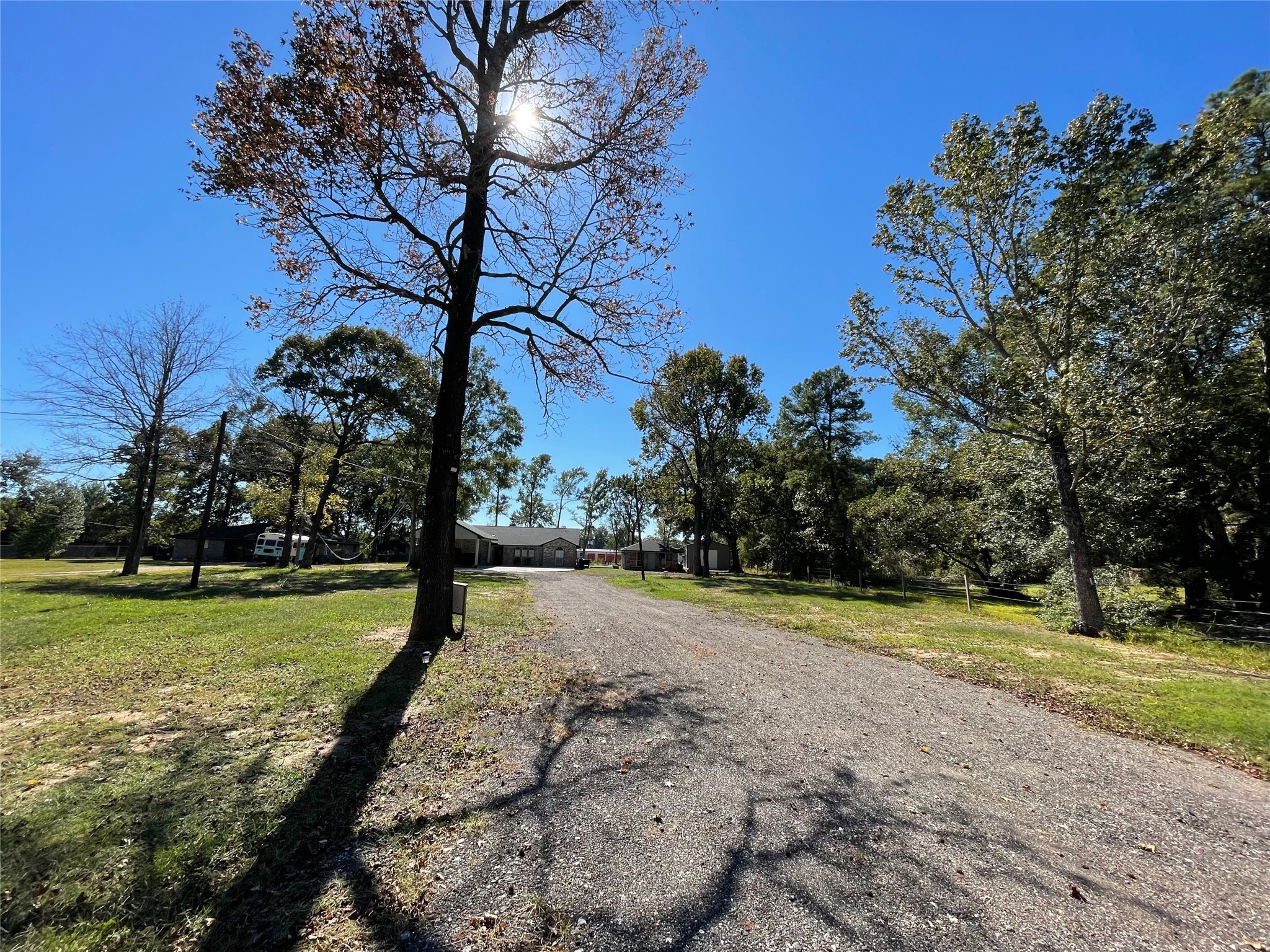 23460 Smith Road Porter, TX 77365 - Photo 2 of 46 a view of a golf ground with large trees