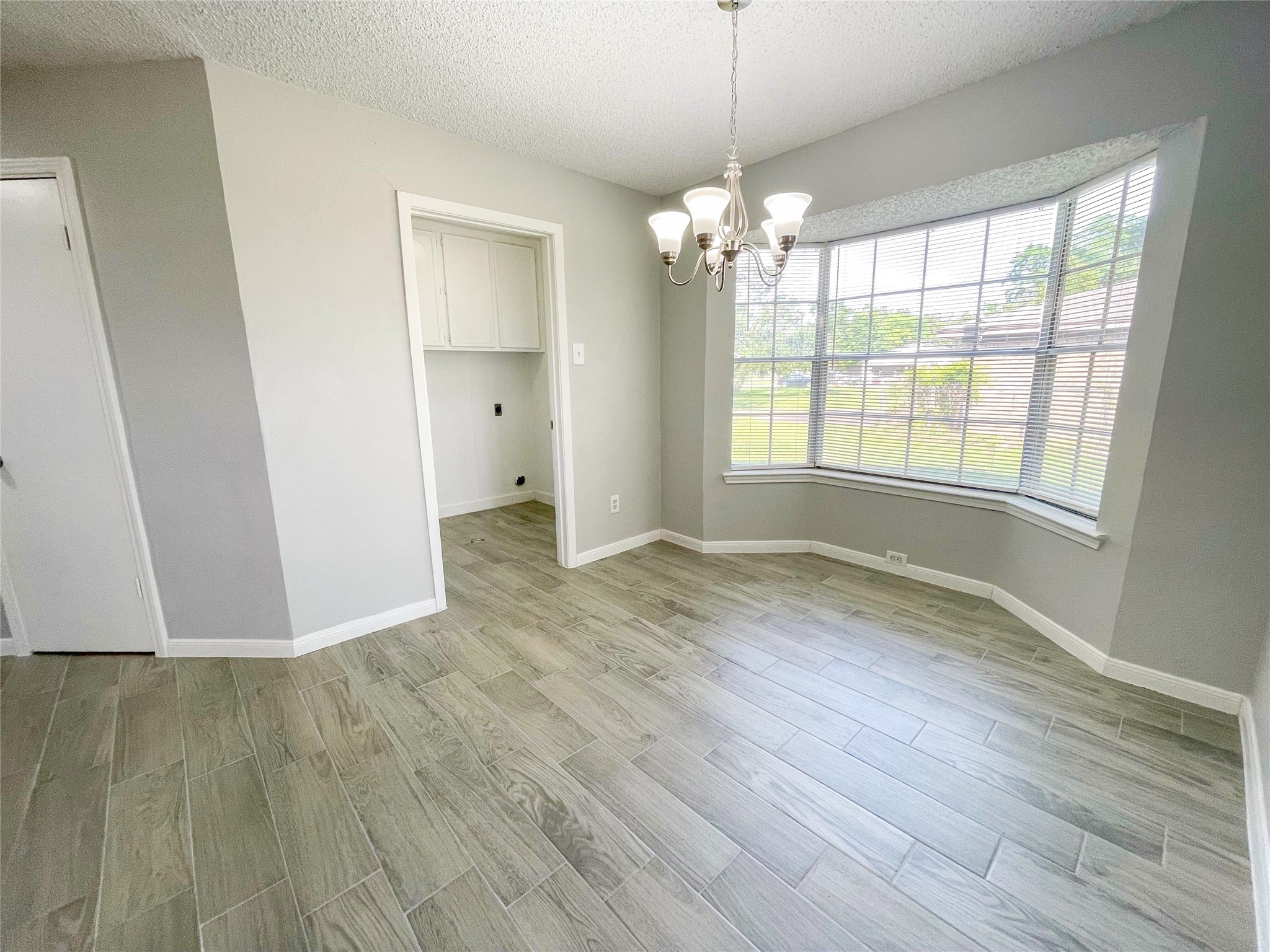 23460 Smith Road Porter, TX 77365 - Photo 21 of 46 a view of an empty room with wooden floor and a window