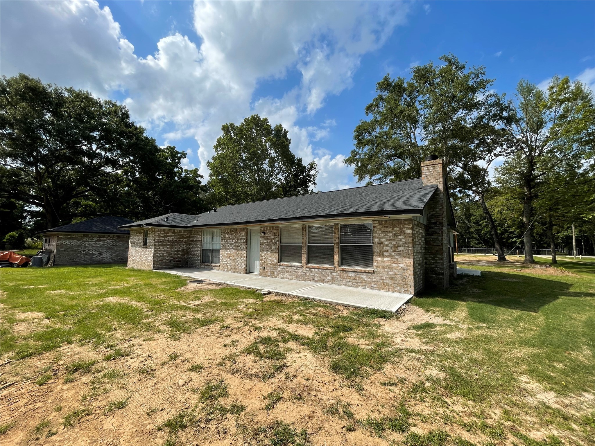 23460 Smith Road Porter, TX 77365 - Photo 39 of 46 a front view of house with yard and trees in the background