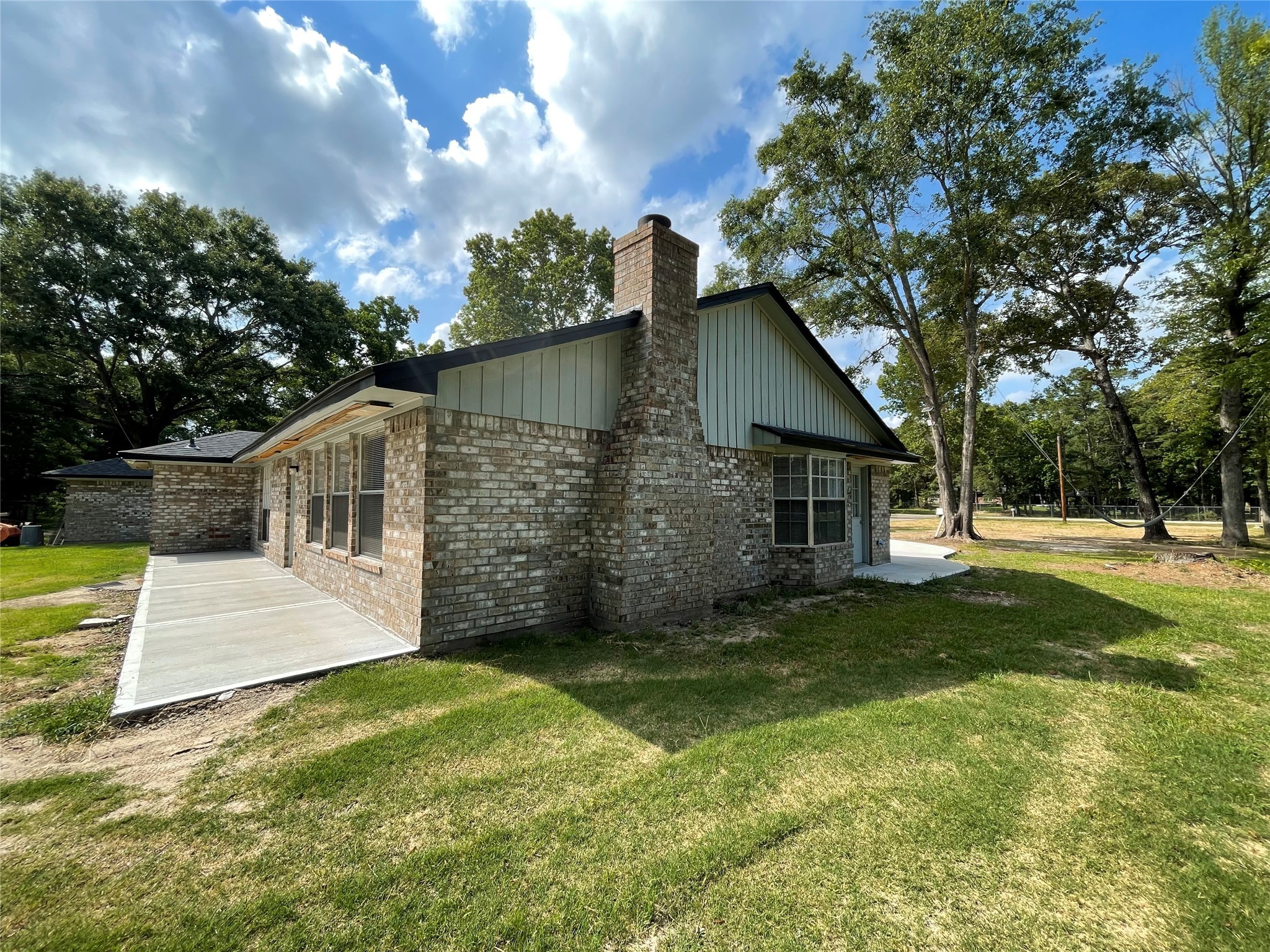 23460 Smith Road Porter, TX 77365 - Photo 40 of 46 a view of a yard in front of a house with large tree