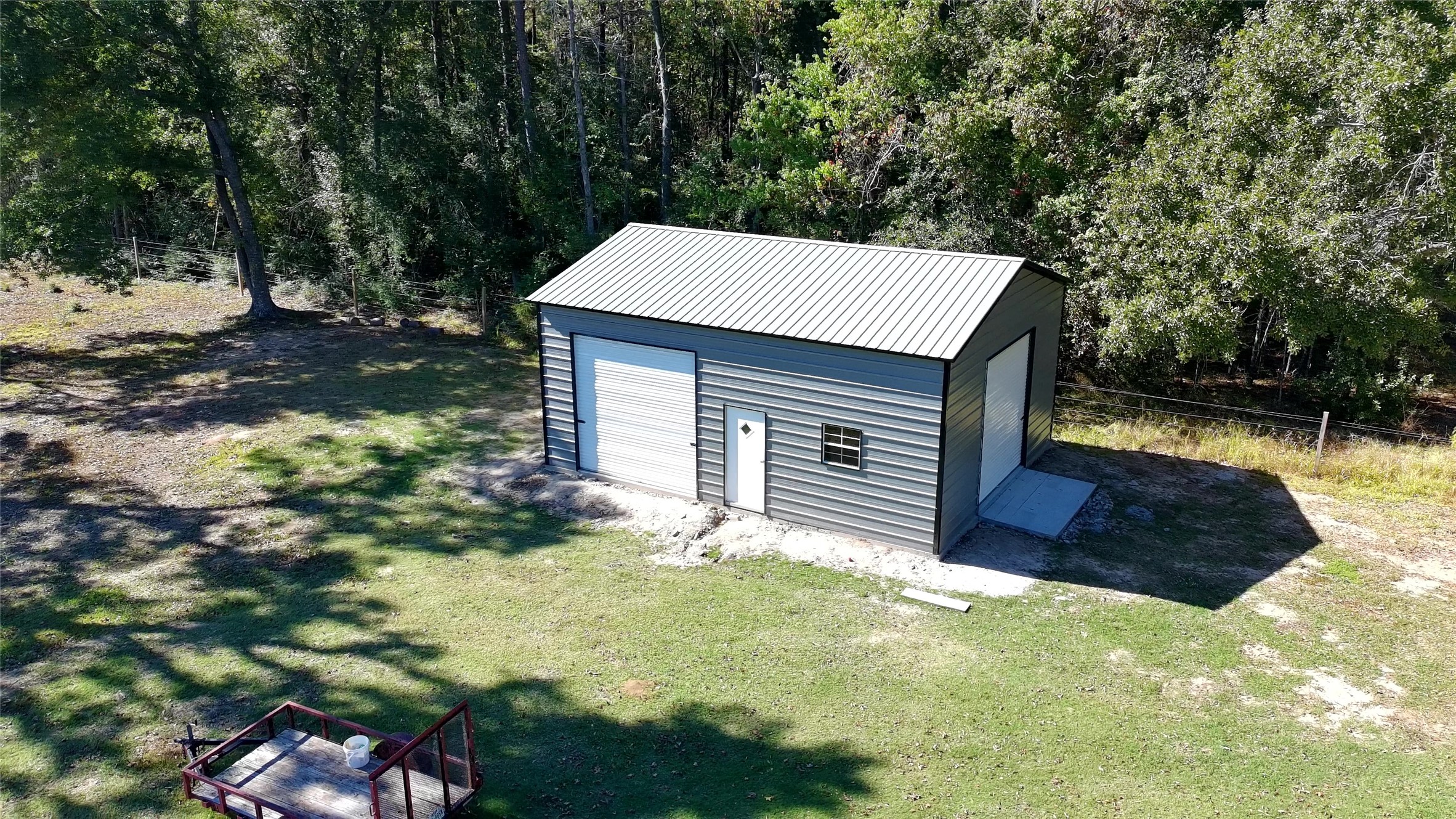 23460 Smith Road Porter, TX 77365 - Photo 45 of 46 a view of a house with backyard and a tree