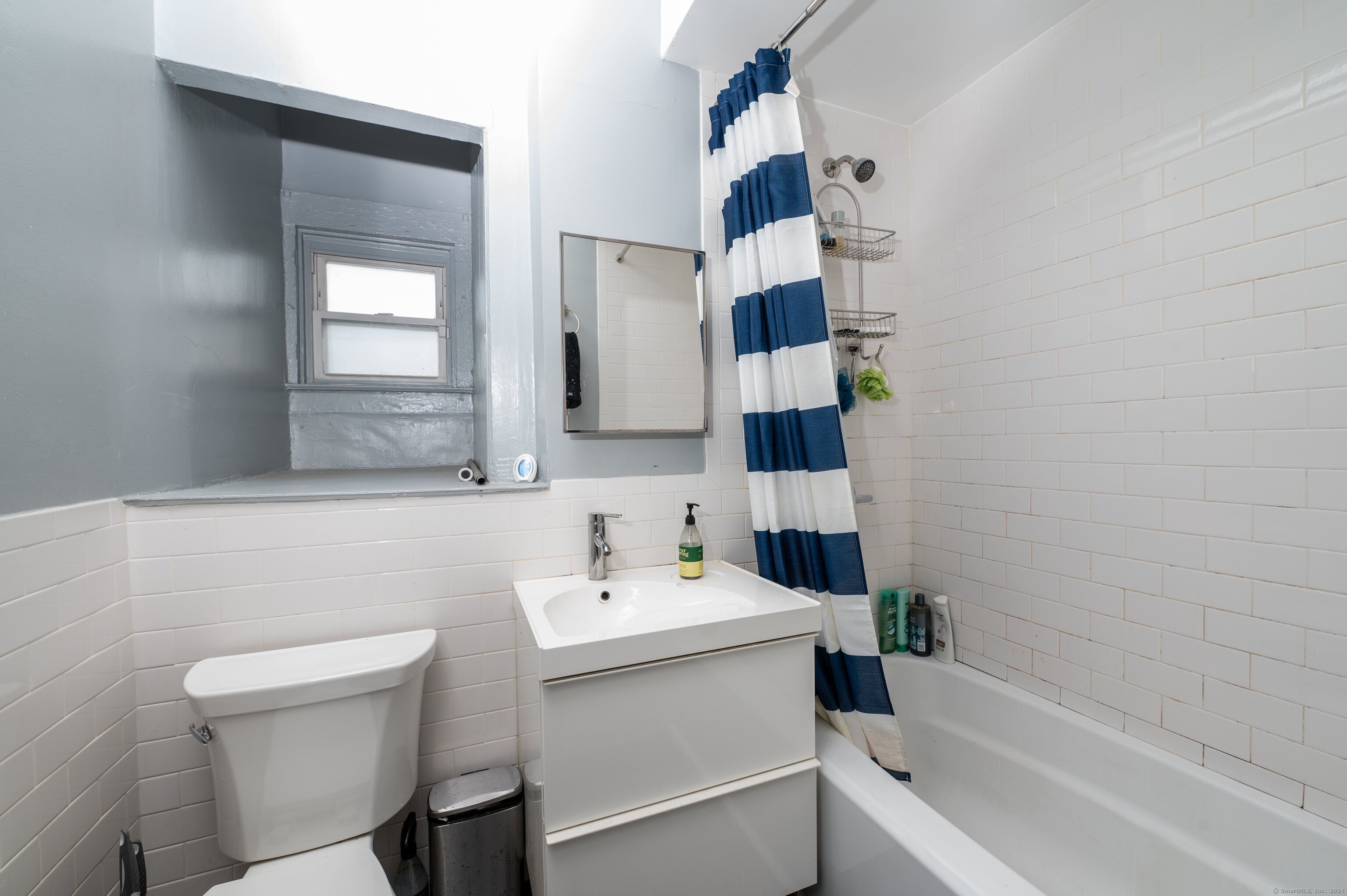 54 Mechanic Street New Haven, CT 06511 - Photo 11 of 22 a bathroom with a sink toilet and shower