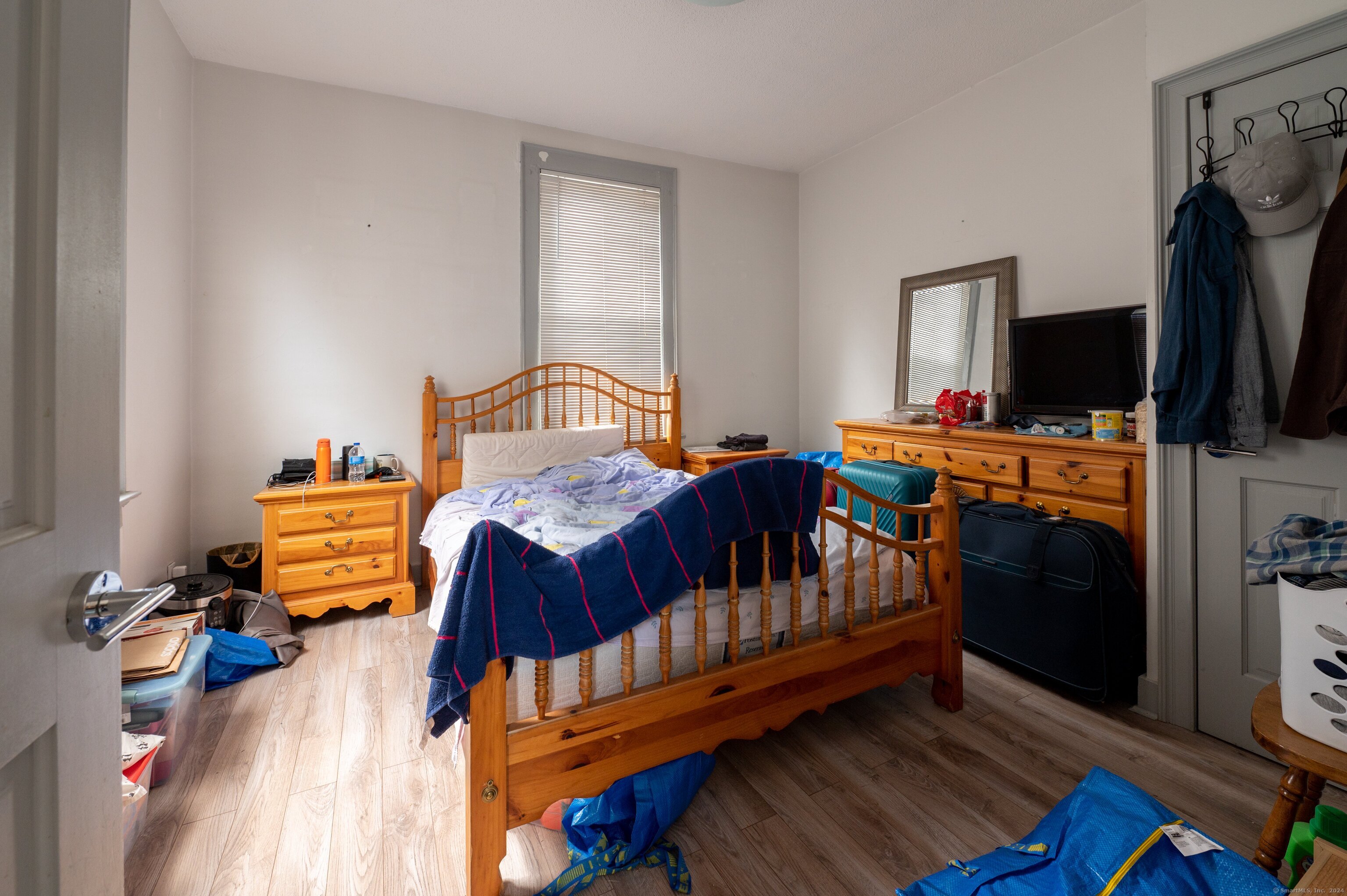 54 Mechanic Street New Haven, CT 06511 - Photo 15 of 22 a bedroom with furniture and a flat screen tv