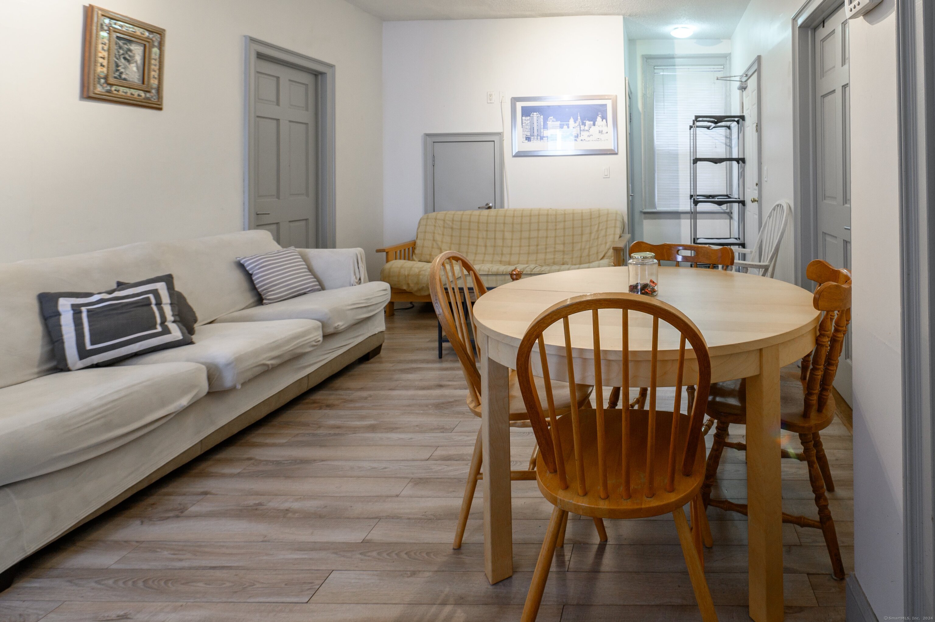 54 Mechanic Street New Haven, CT 06511 - Photo 18 of 22 a living room with furniture a table and painting on the wall