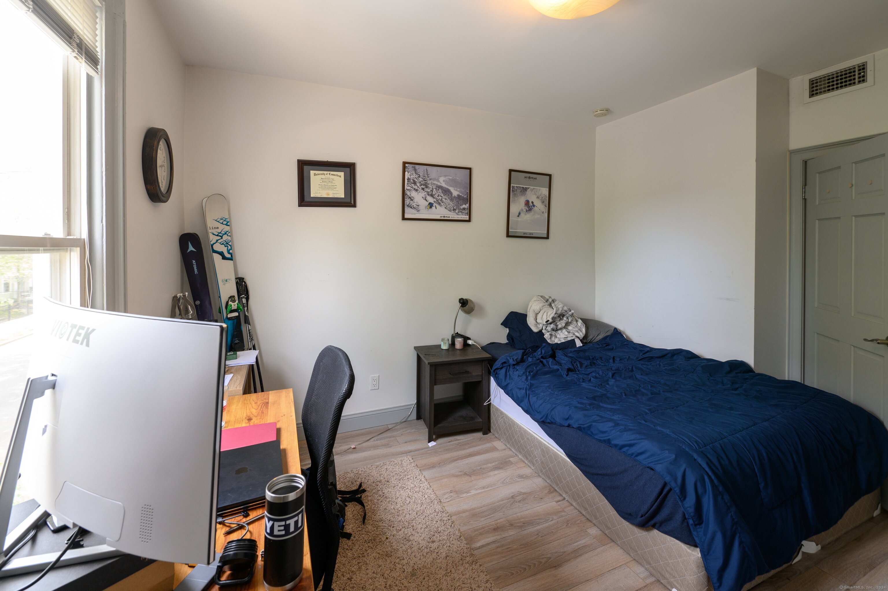 54 Mechanic Street New Haven, CT 06511 - Photo 4 of 22 a bed room with a bed and a chair