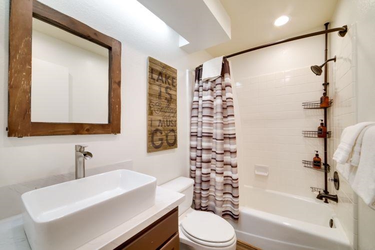 591 Golden Creek Road, Unit 591 Mammoth Lakes, CA 93546 - Photo 18 of 19 a bathroom with a sink a toilet and shower