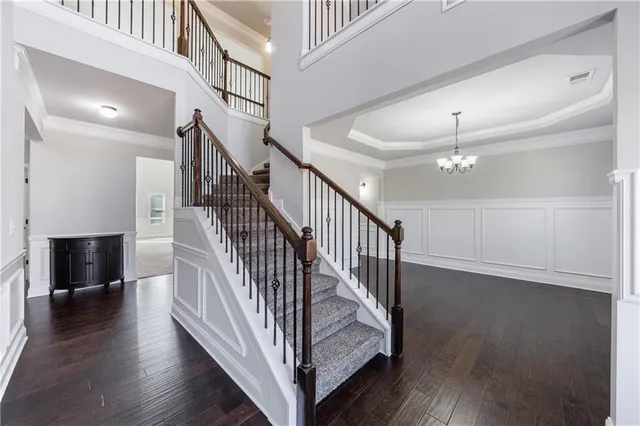 a bathroom with a granite countertop sink a toilet and shower