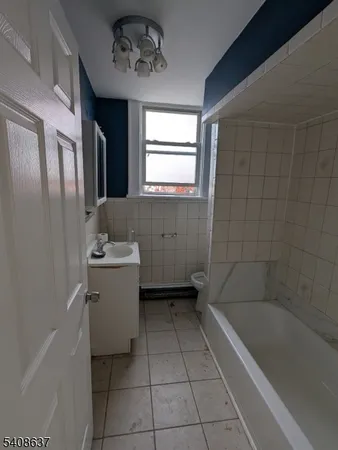 a bathroom with a bathtub sink and toilet
