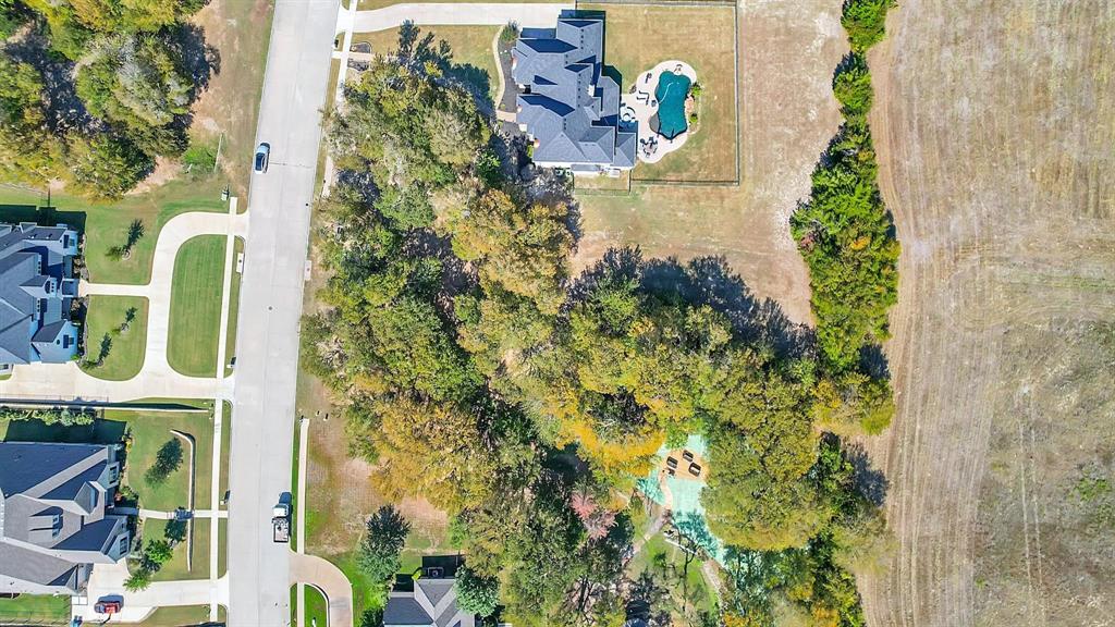 133 Falcon Point Drive Heath, TX 75032 - Photo 8 of 11 an aerial view of a house with a yard and garden