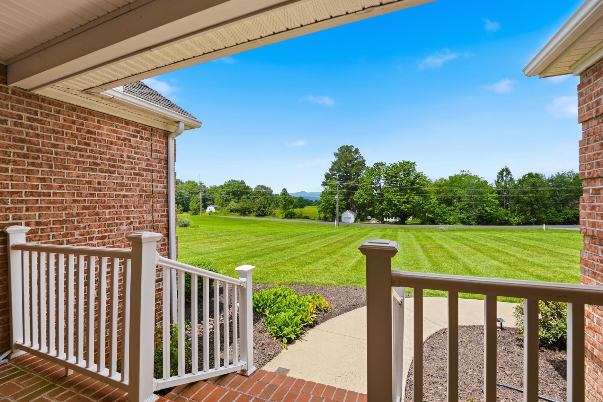 11337 Old Stillhouse Road Boston, VA 22713 - Photo 11 of 58 a view of a deck and a yard with large tree