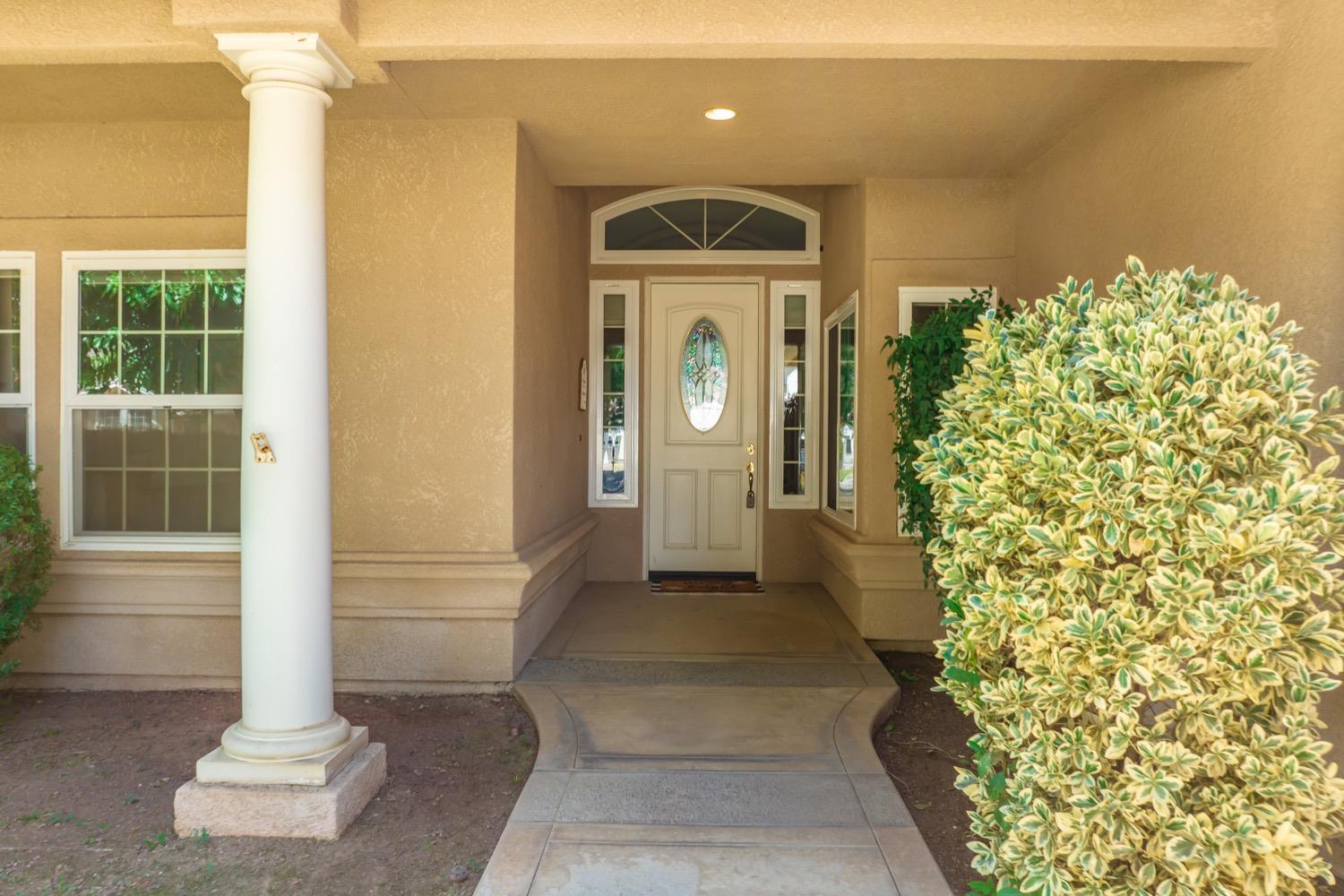 3432 Doubletree Way Madera, CA 93637 - Photo 2 of 45 a front view of a house with a yard