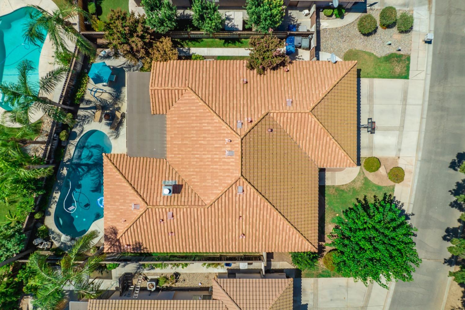 3432 Doubletree Way Madera, CA 93637 - Photo 27 of 45 an aerial view of a house with a yard and large trees