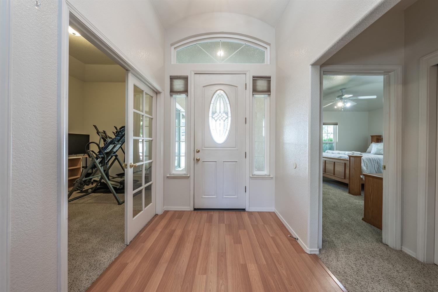 3432 Doubletree Way Madera, CA 93637 - Photo 3 of 45 a view of a livingroom with wooden floor and a ceiling fan