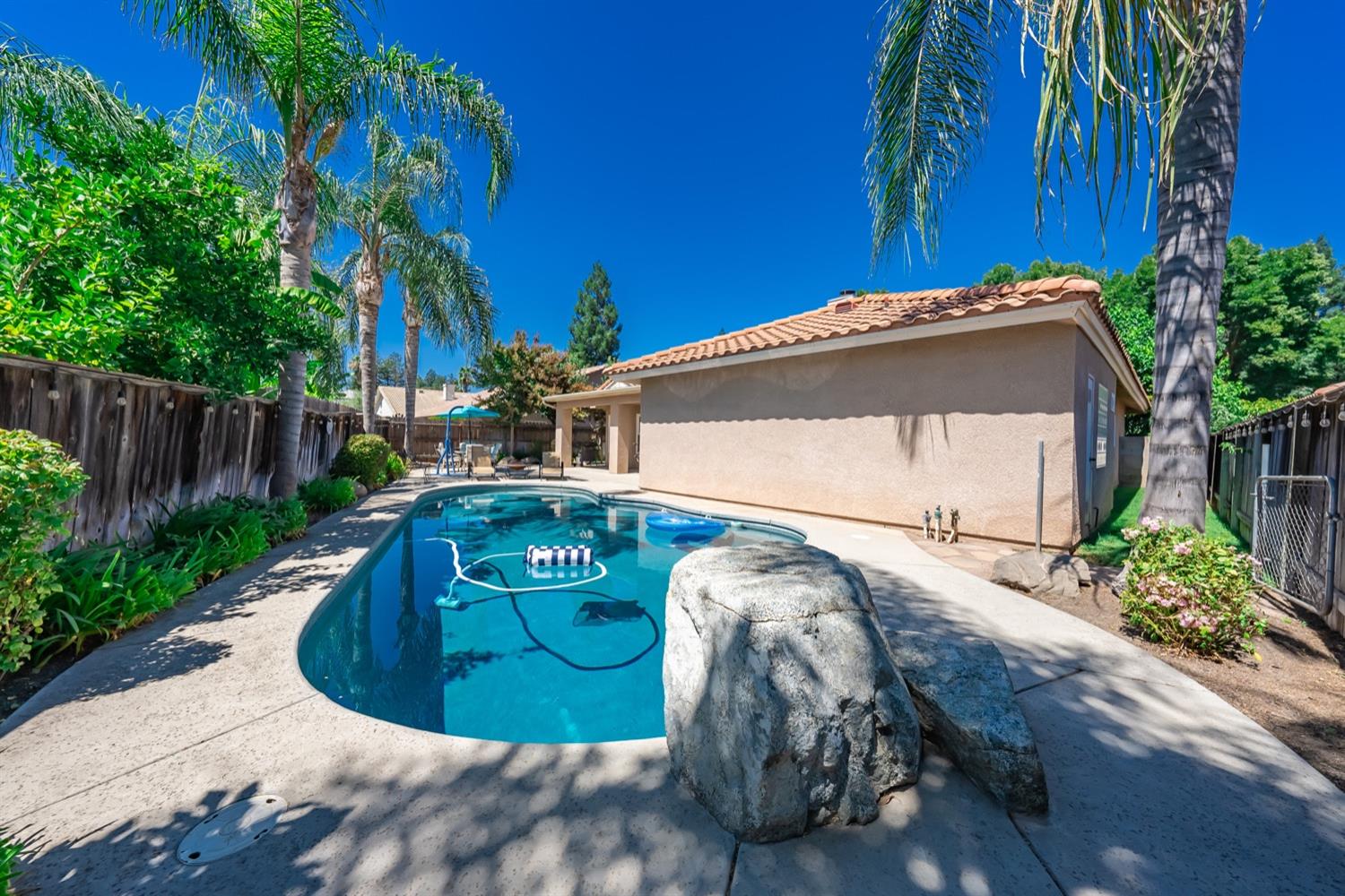 3432 Doubletree Way Madera, CA 93637 - Photo 34 of 45 a view of a house with a small yard and plants