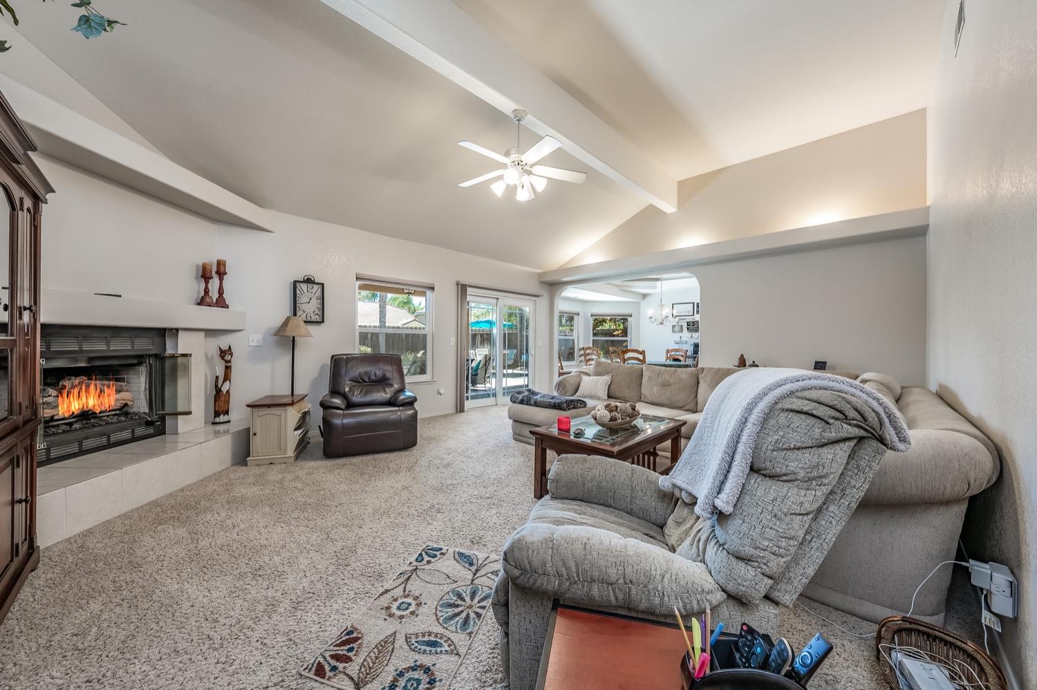 3432 Doubletree Way Madera, CA 93637 - Photo 5 of 45 a living room with furniture and a fireplace