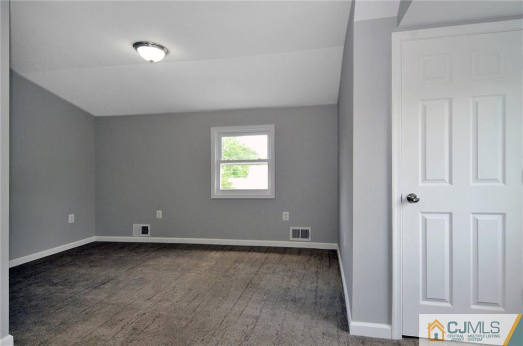 29 Stockton Road New Brunswick, NJ 08901 - Photo 15 of 21 an empty room with a window