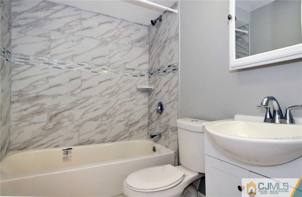 29 Stockton Road New Brunswick, NJ 08901 - Photo 17 of 21 a bathroom with a toilet and a sink