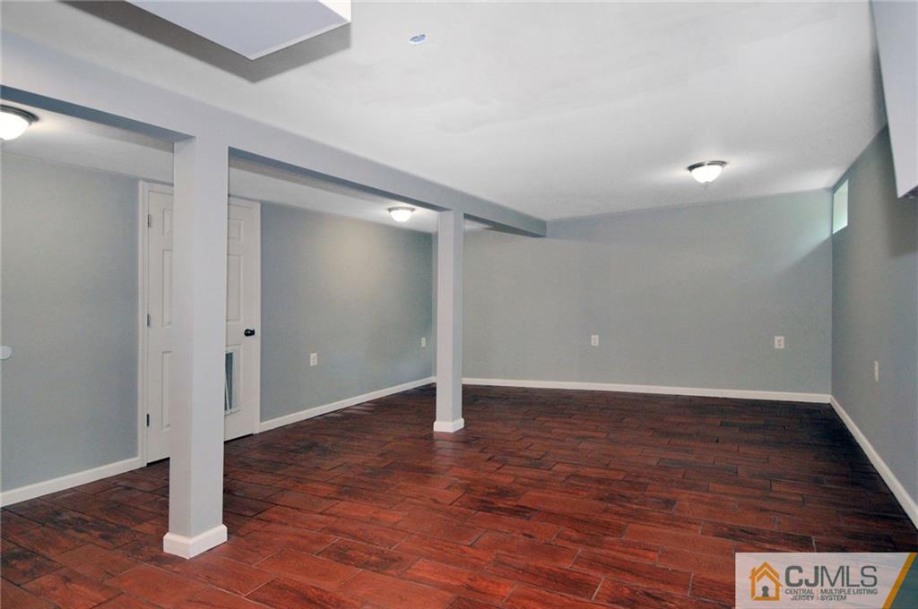 29 Stockton Road New Brunswick, NJ 08901 - Photo 18 of 21 a view of an empty room with wooden floor