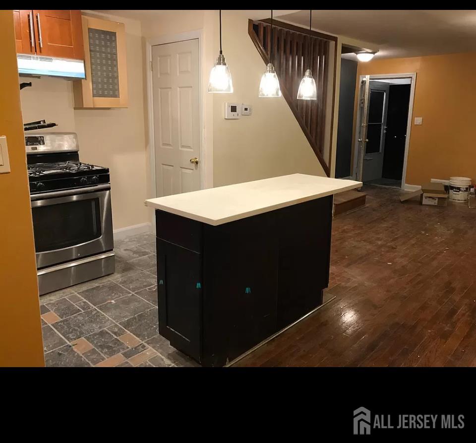 94 MacArthur Drive Edison, NJ 08837 - Photo 4 of 10 a kitchen with a sink and cabinets