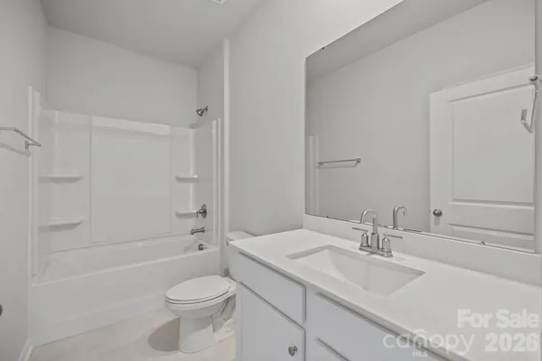 a bathroom with a toilet a sink and a bathtub