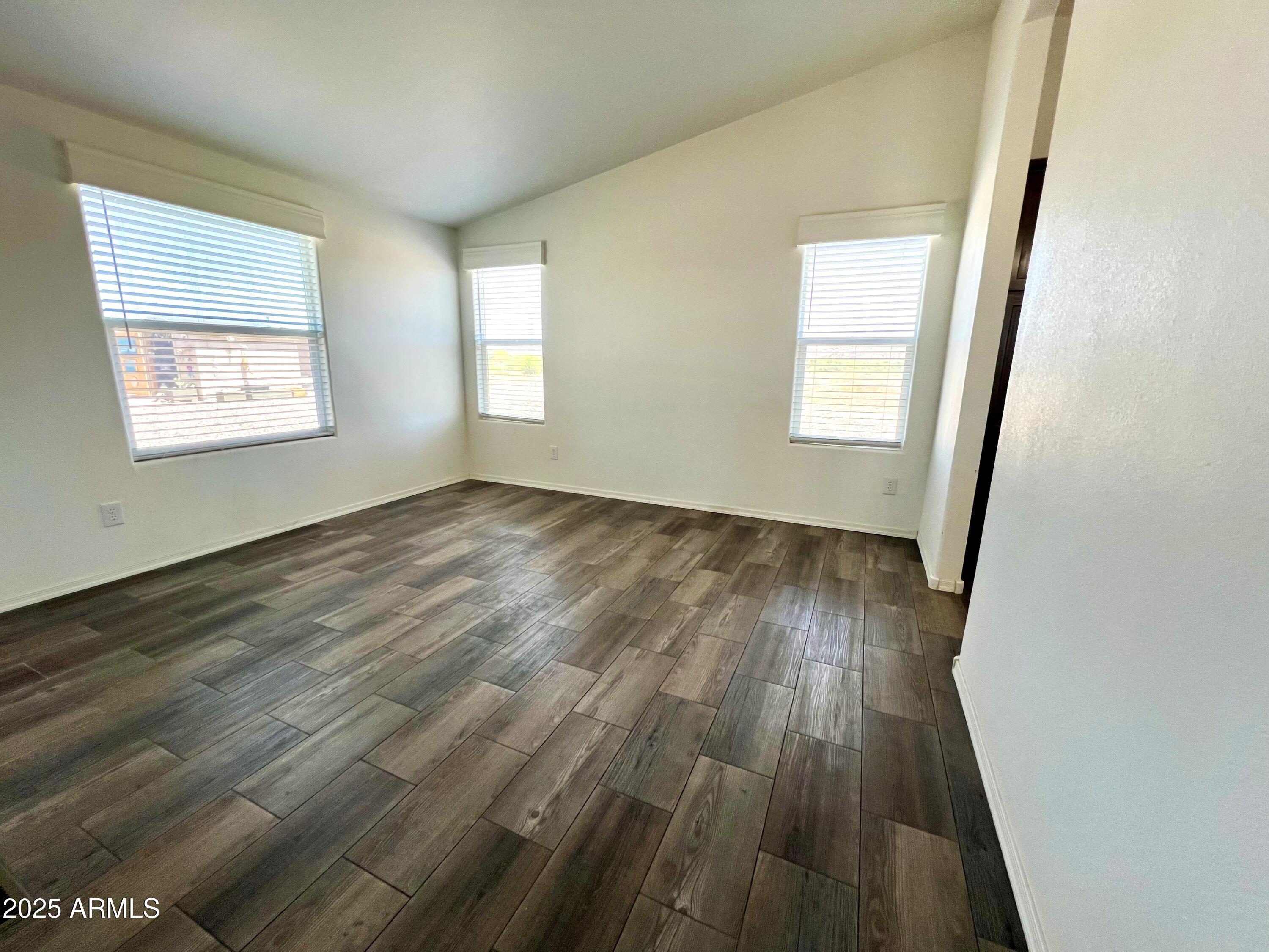 80 South Copper Canyon Loop Camp Verde, AZ 86322 - Photo 19 of 52 an empty room with wooden floor and windows