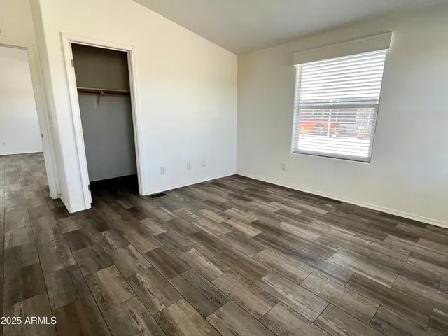 a bathroom with sink a mirror a vanity and shower