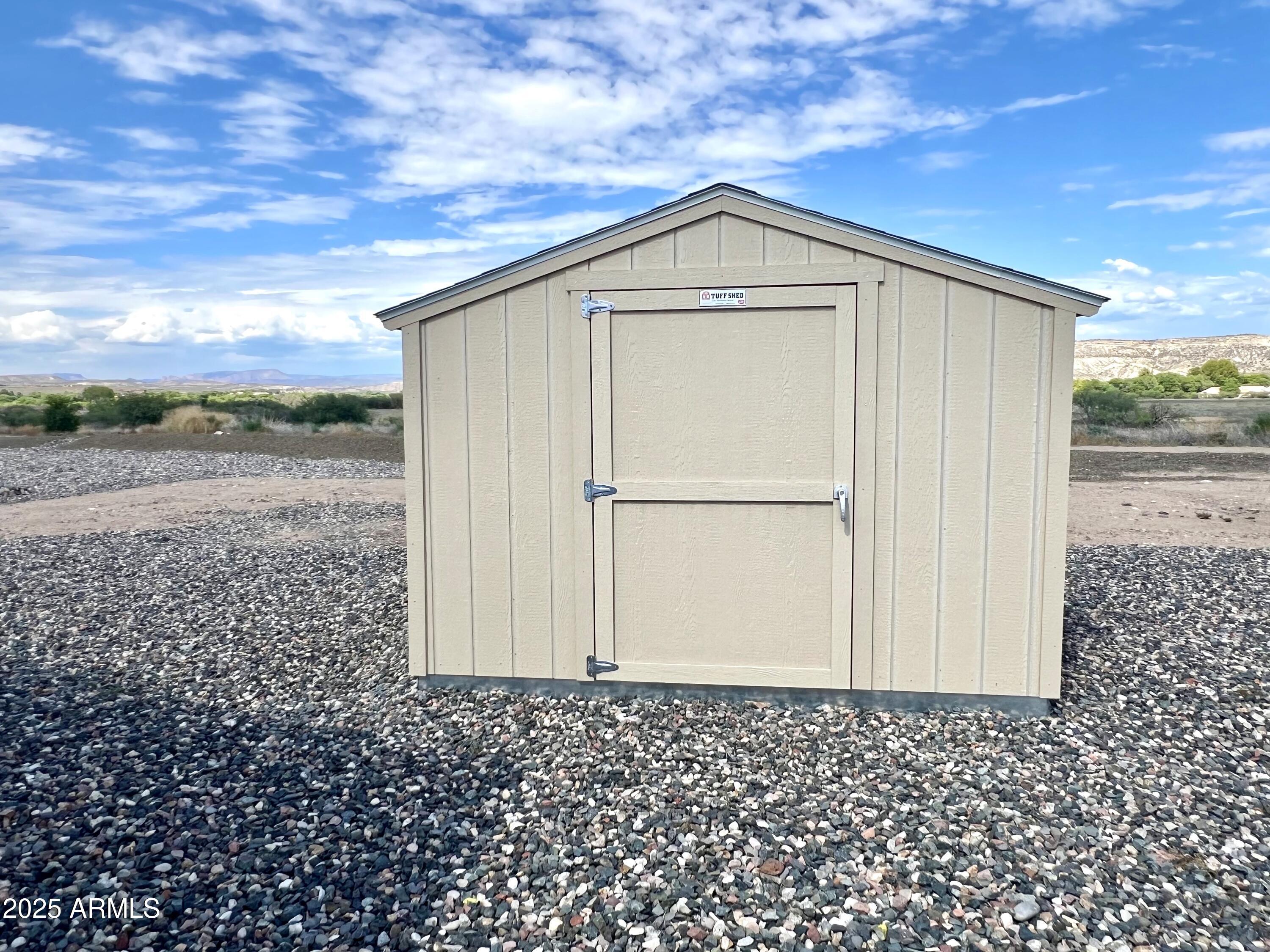 80 South Copper Canyon Loop Camp Verde, AZ 86322 - Photo 34 of 52 a front view of a house with a yard