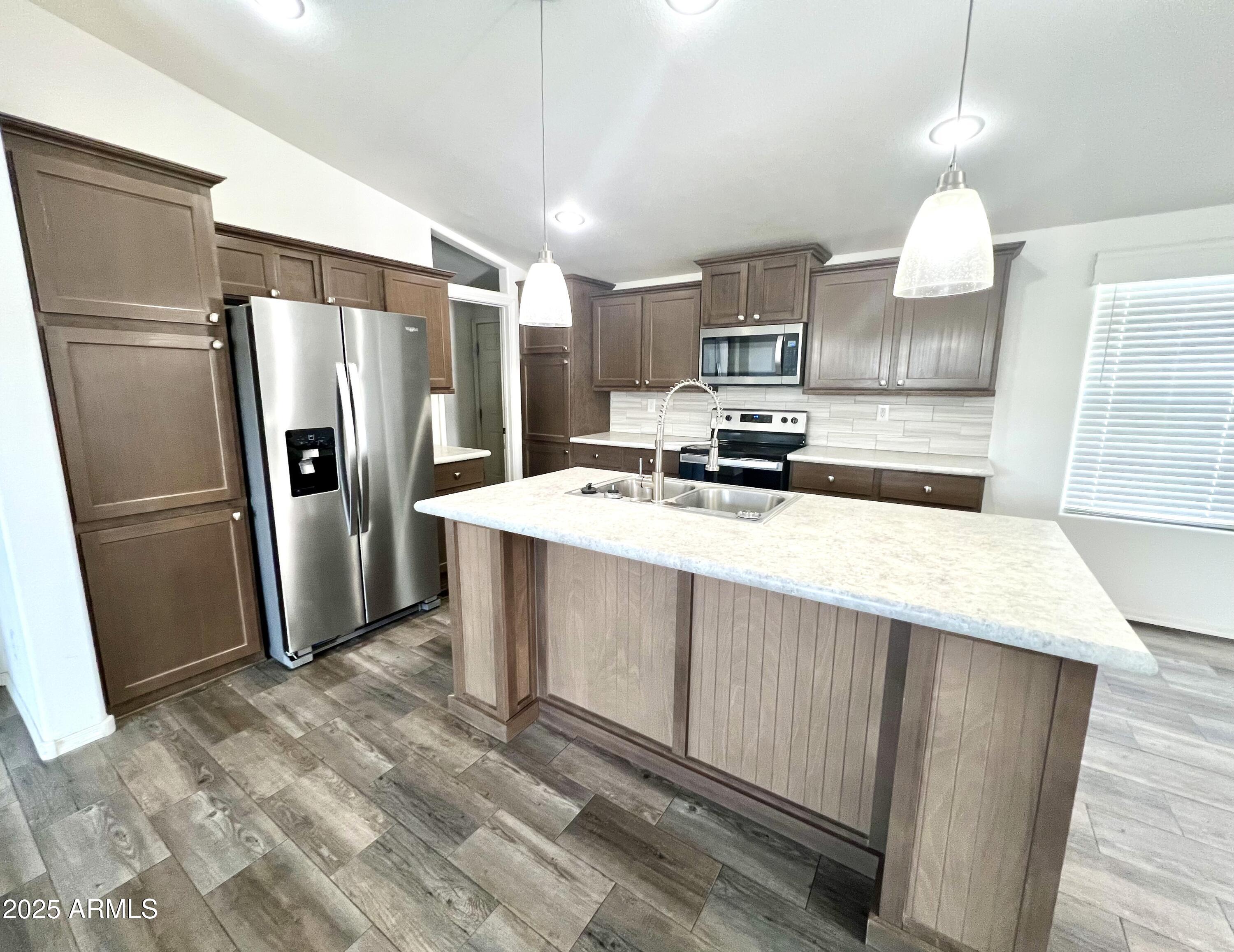 80 South Copper Canyon Loop Camp Verde, AZ 86322 - Photo 9 of 52 a kitchen with stainless steel appliances a refrigerator sink and microwave