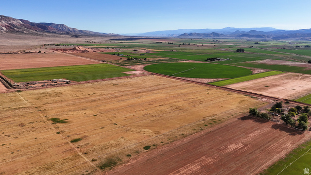 2070 East Tbd Road North Richfield, UT 84701 - Photo 11 of 35 Expansive agricultural land featuring cultivated fields, natural terrain, and distant mountain ranges