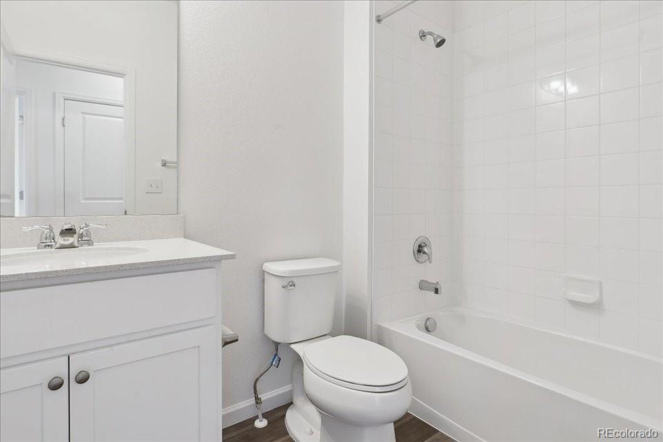 6800 Merseyside Lane, Unit 166 Castle Pines, CO 80108 - Photo 14 of 21 a bathroom with a sink toilet vanity and bathtub
