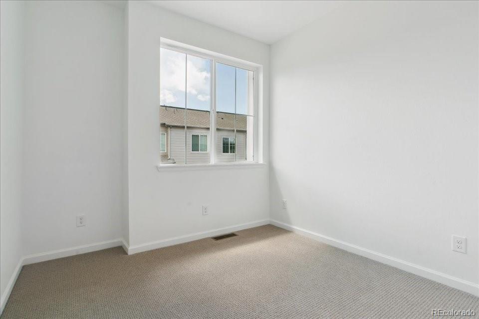 6800 Merseyside Lane, Unit 166 Castle Pines, CO 80108 - Photo 15 of 21 an empty room with a window